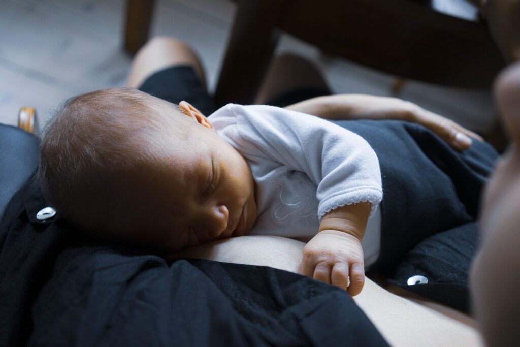 when to stop holding baby to sleep