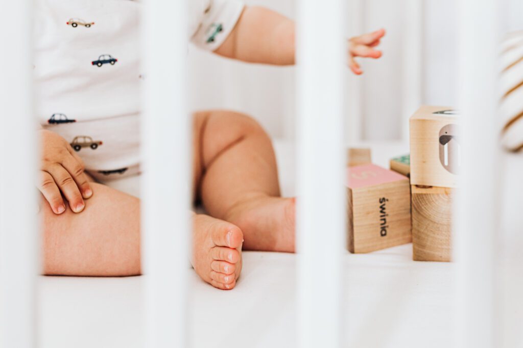 baby sitting up in crib not sleeping